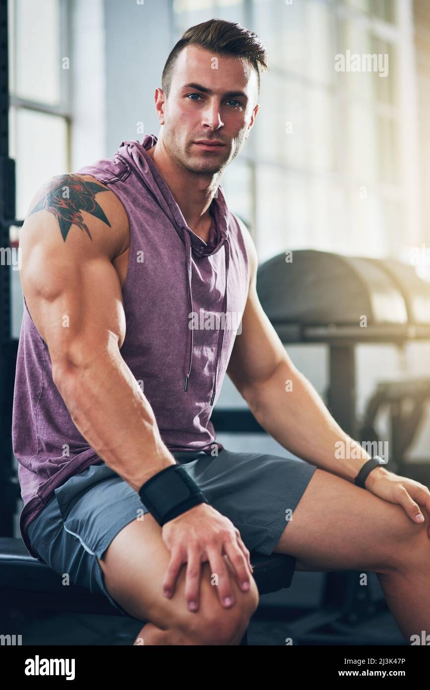 Its about maintaining discipline. Portrait of a muscular young man