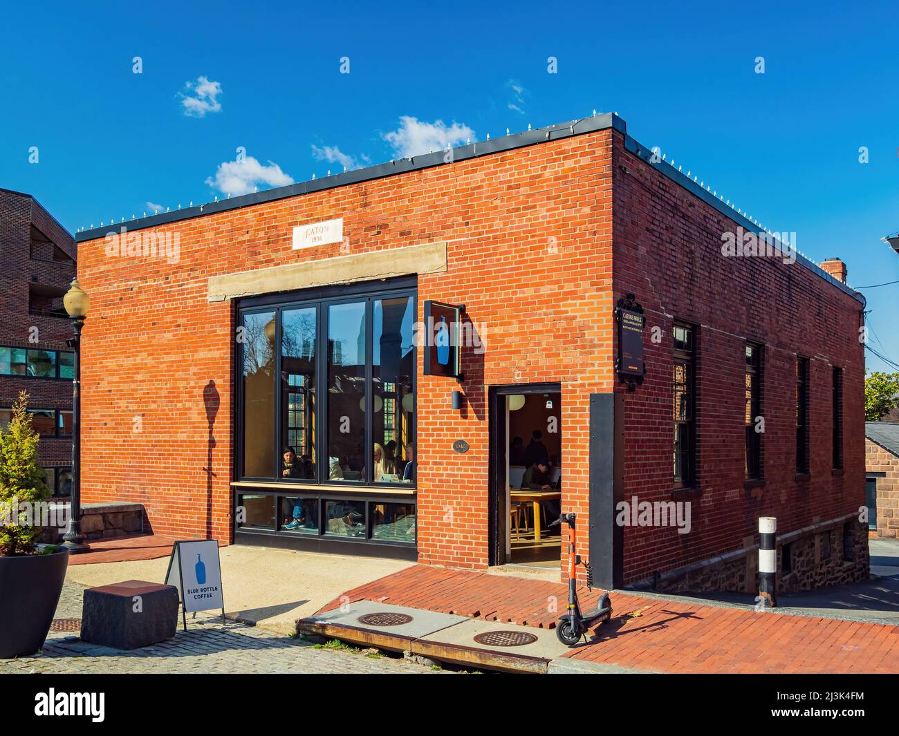 Washington DC, APR 3 2022 Sunny view of the Blue Bottle Coffee Stock