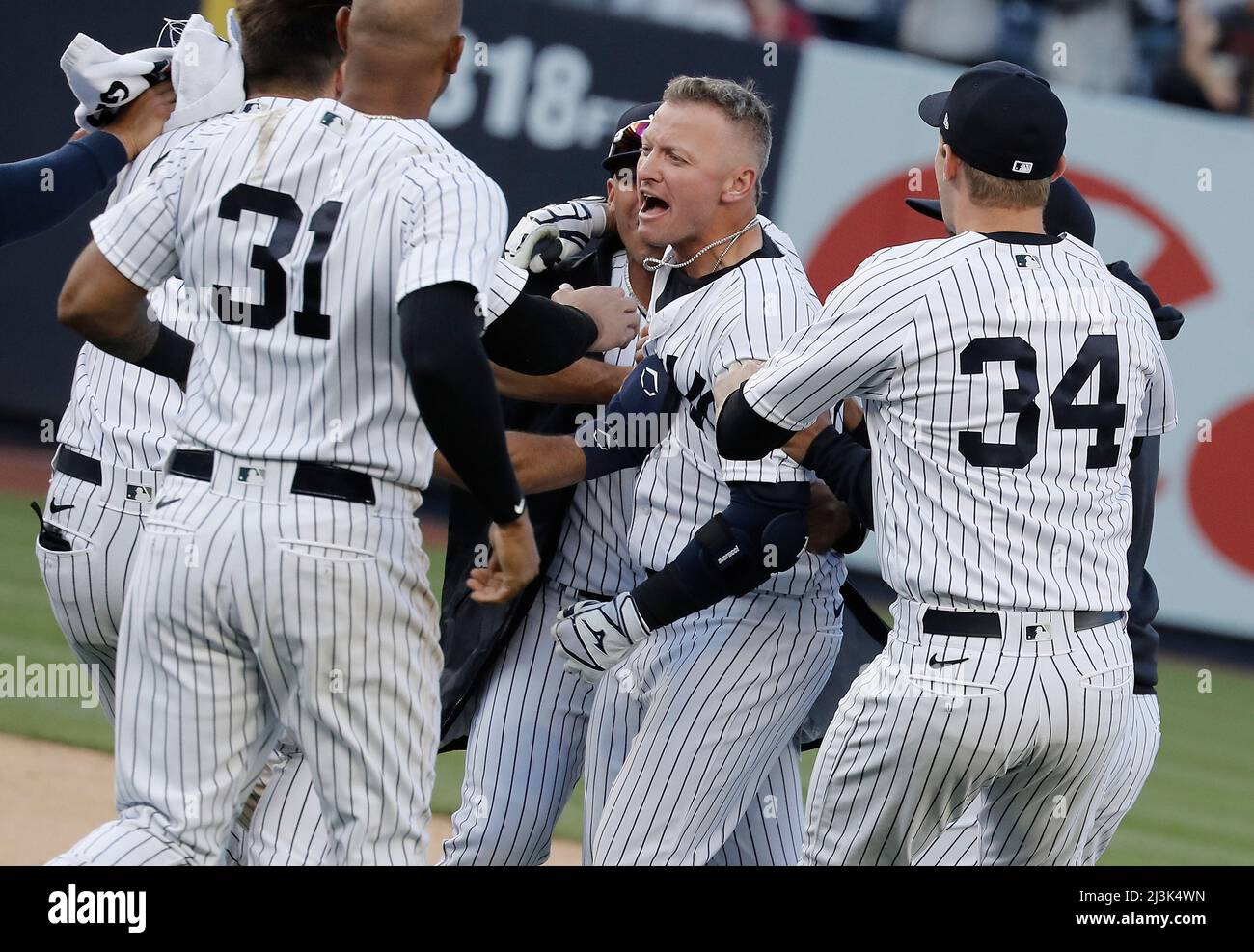 Bronx, USA. 08th Apr, 2022. New York Yankees Josh Donaldson, center  celebrates with his teammates after hitting the game winning hit in the  11th inning against the Boston Red Sox on opening