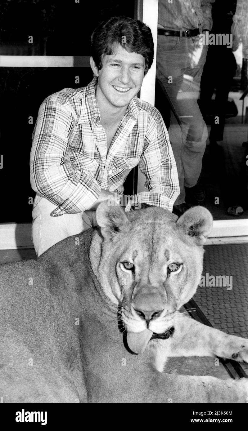 A young man, student Phil Engelauf and his pet lion, Duchess at school at Cal Tech in Pasadena, CA. Stock Photo