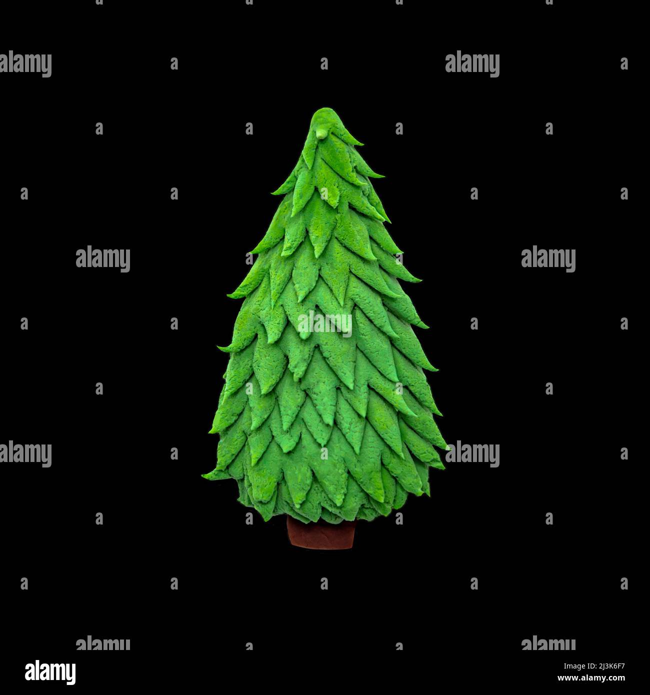 Plasticine Christmas tree, isolated on black. Clipart for collage. Stock Photo