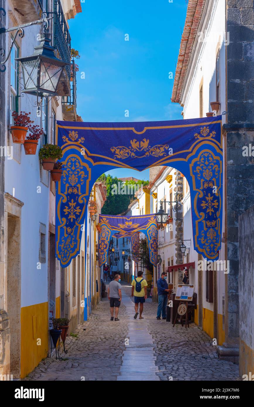 Obidos, Portugal, July 1, 2021: View of a narrow street inside of the obidos castle in Portugal. Stock Photo