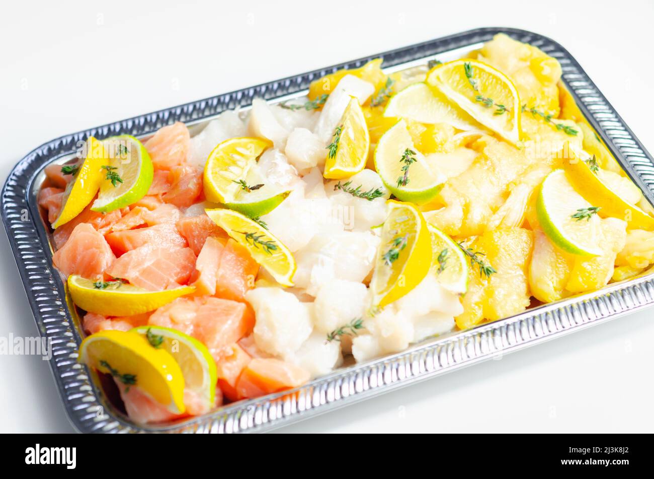 Fish pie mix, raw skinless and boneless cod, dyed smoked haddock and