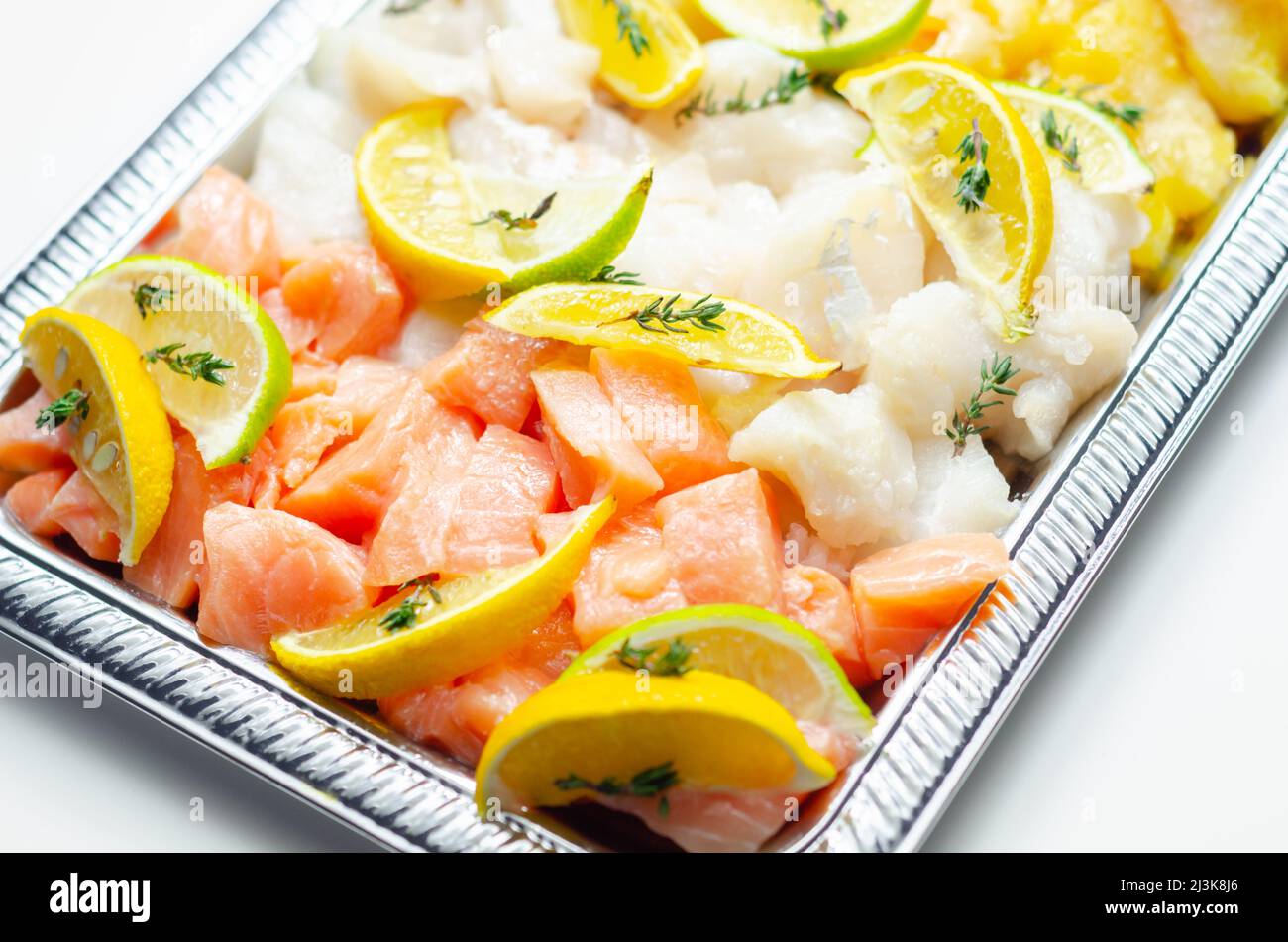 Fish pie mix, raw skinless and boneless cod, dyed smoked haddock and