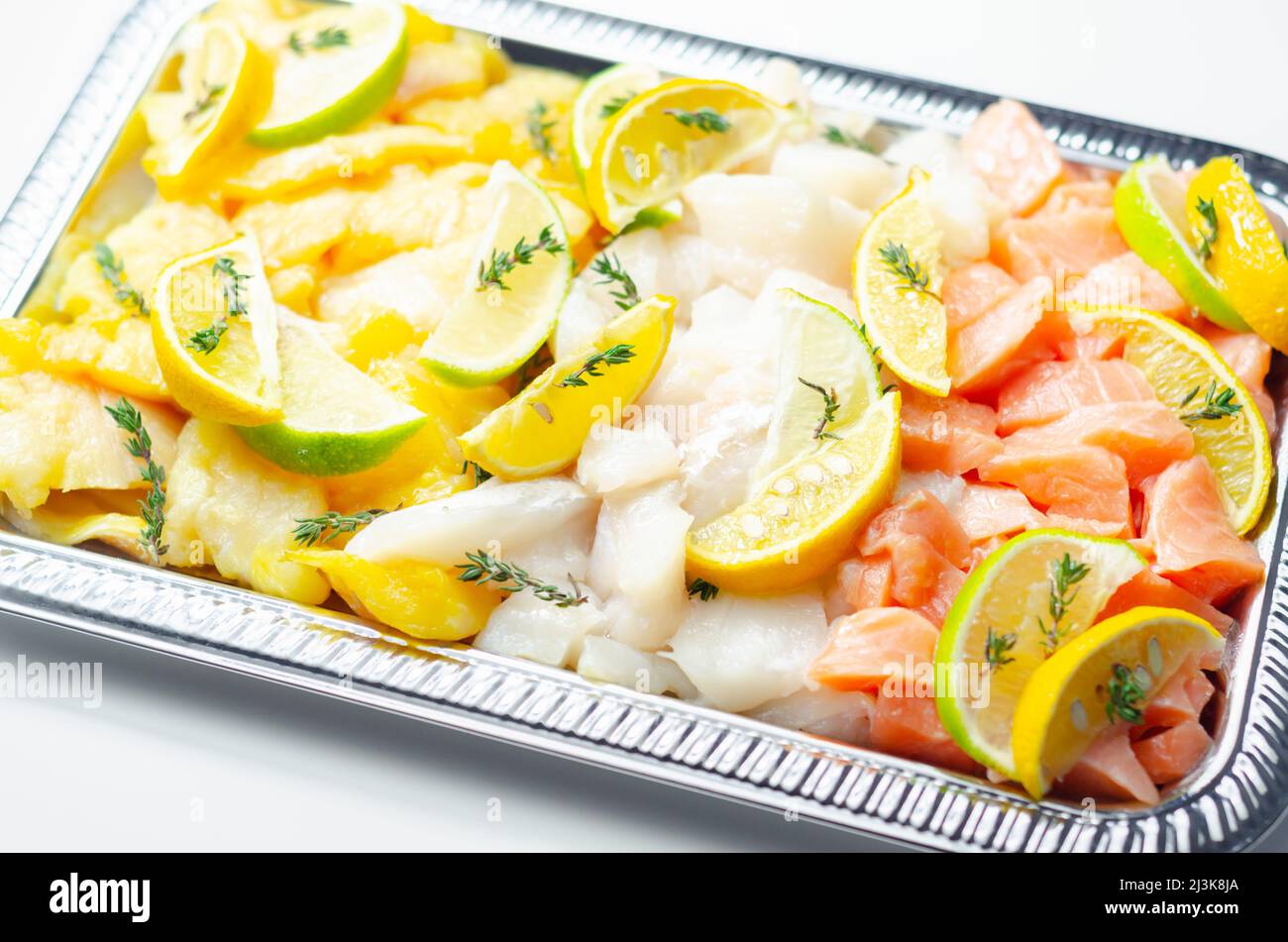 Fish pie mix, raw skinless and boneless cod, dyed smoked haddock and