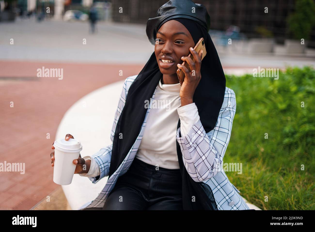 Joyful African American lady in trendy 