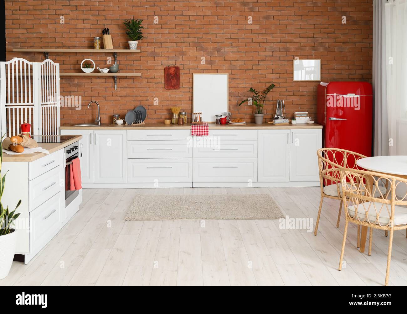 Interior of modern kitchen with stylish refrigerator and counters Stock ...