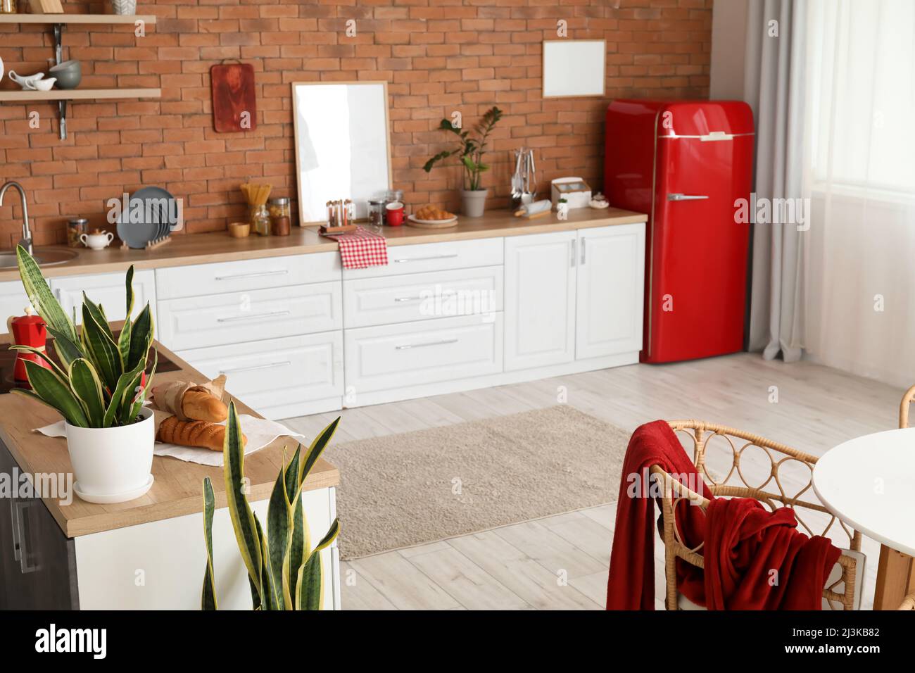 Interior of modern kitchen with stylish refrigerator and counters Stock ...