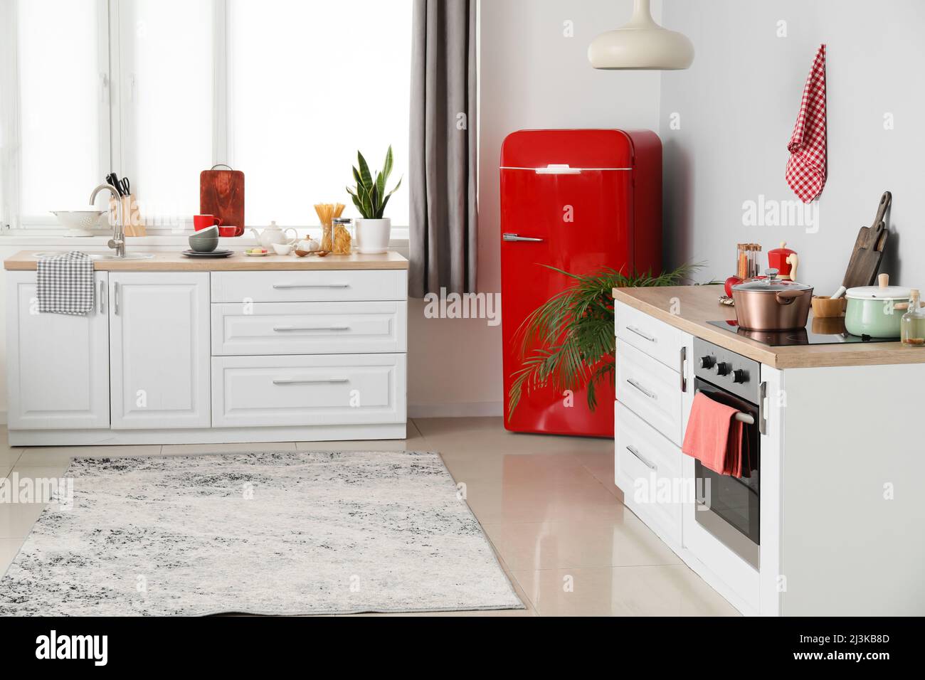 Interior of modern kitchen with stylish refrigerator and counters Stock ...