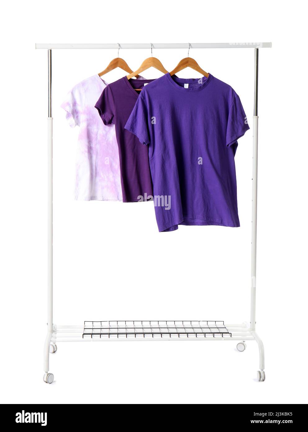 Rack with t-shirts on white background Stock Photo - Alamy