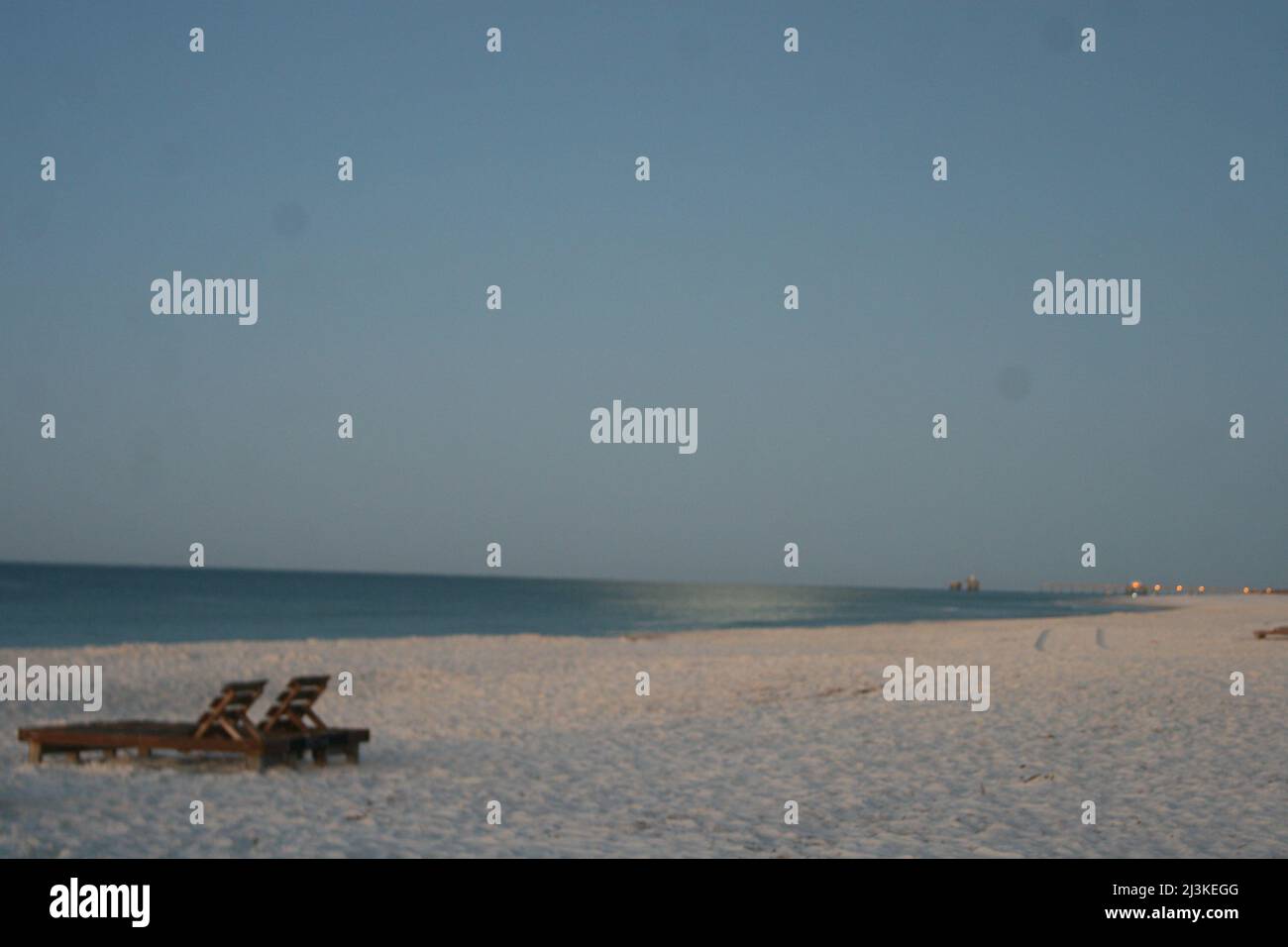 Gulf Shores Beachfront at Sunrise. The suns golden rays fill the sky