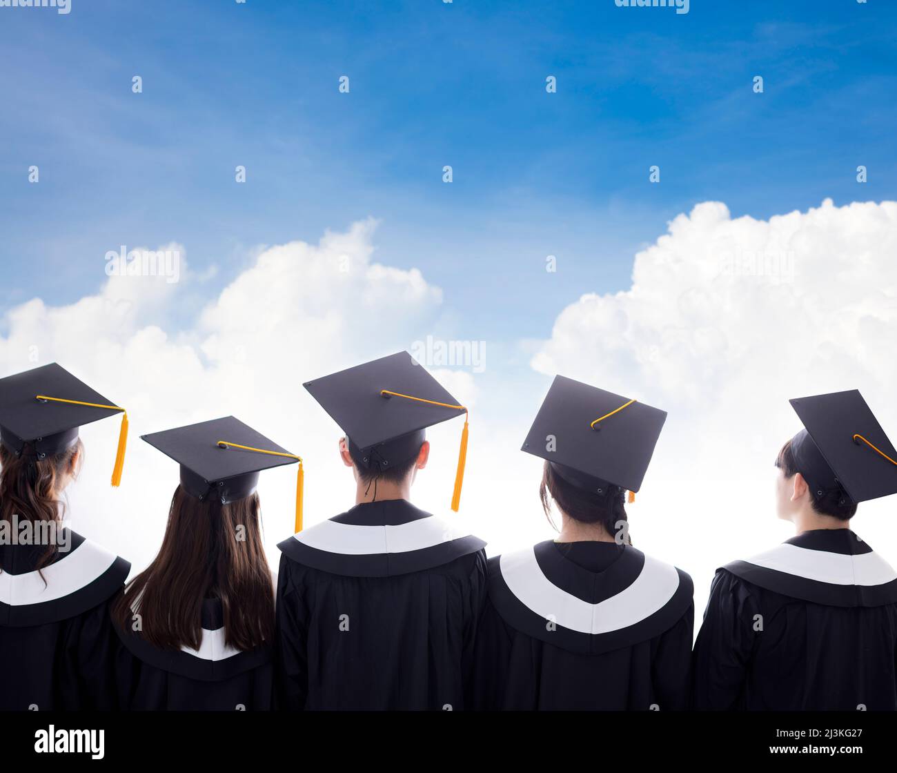 Back View of Diverse Group Of graduation Students watching the cloud Stock Photo