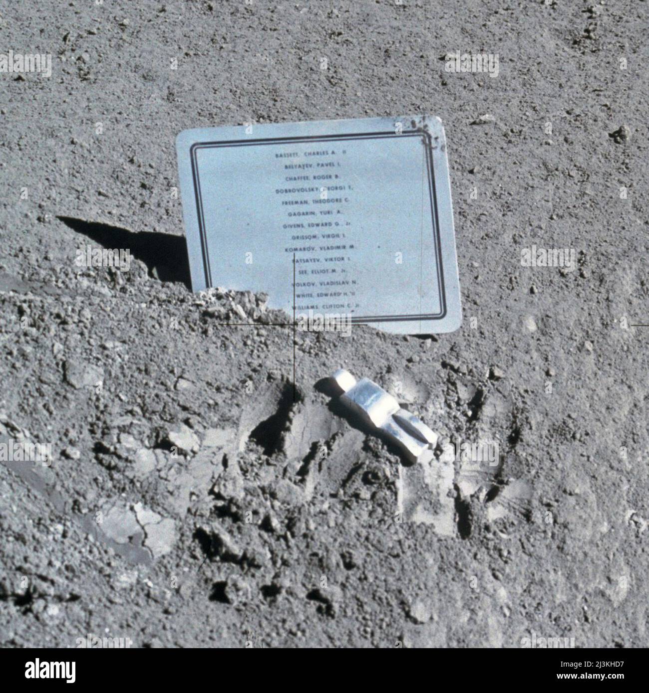 A close-up view of a commemorative plaque left on the Moon at the Hadley-Apennine landing site in memory of 14 NASA astronauts and USSR cosmonauts, now deceased. Their names are inscribed in alphabetical order on the plaque. The plaque was stuck in the lunar soil by Astronauts David Scott and James Irwin during their Apollo 15 expedition. Stock Photo