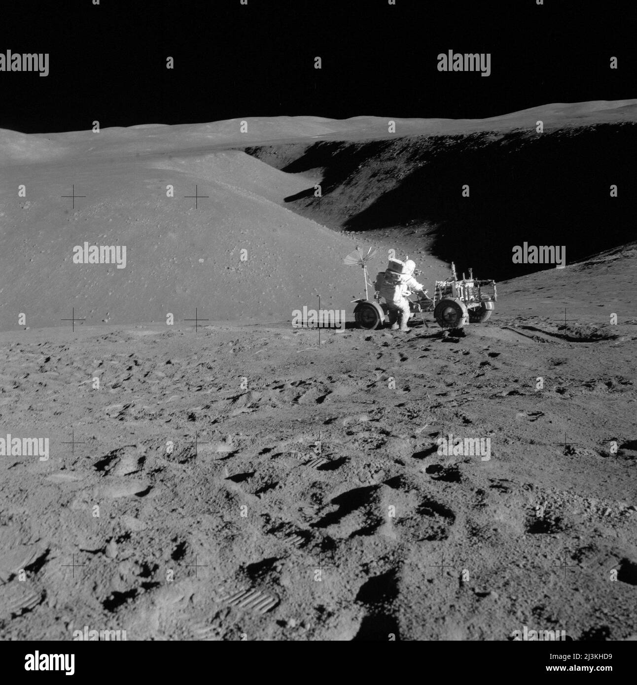 Astronaut David Scott working with the Lonar Rover in Hadley Rille, the landing site of Apollo 15 Stock Photo