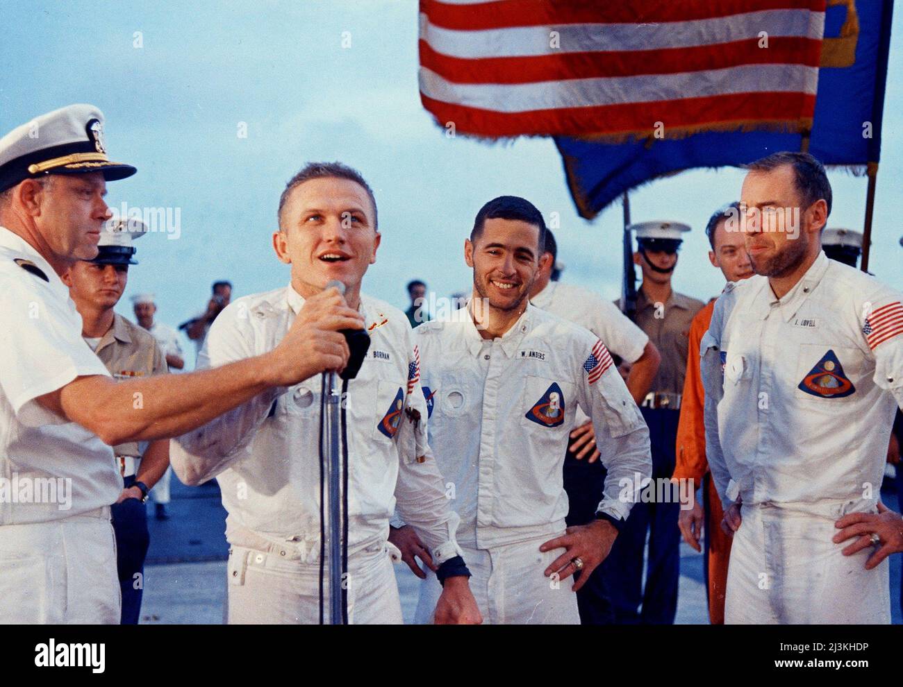 Frank Borman of Apollo 8 addressing the crew of USS Yorktown after successful splashdown and recovery, with other members James Lovell and William Anders. Stock Photo