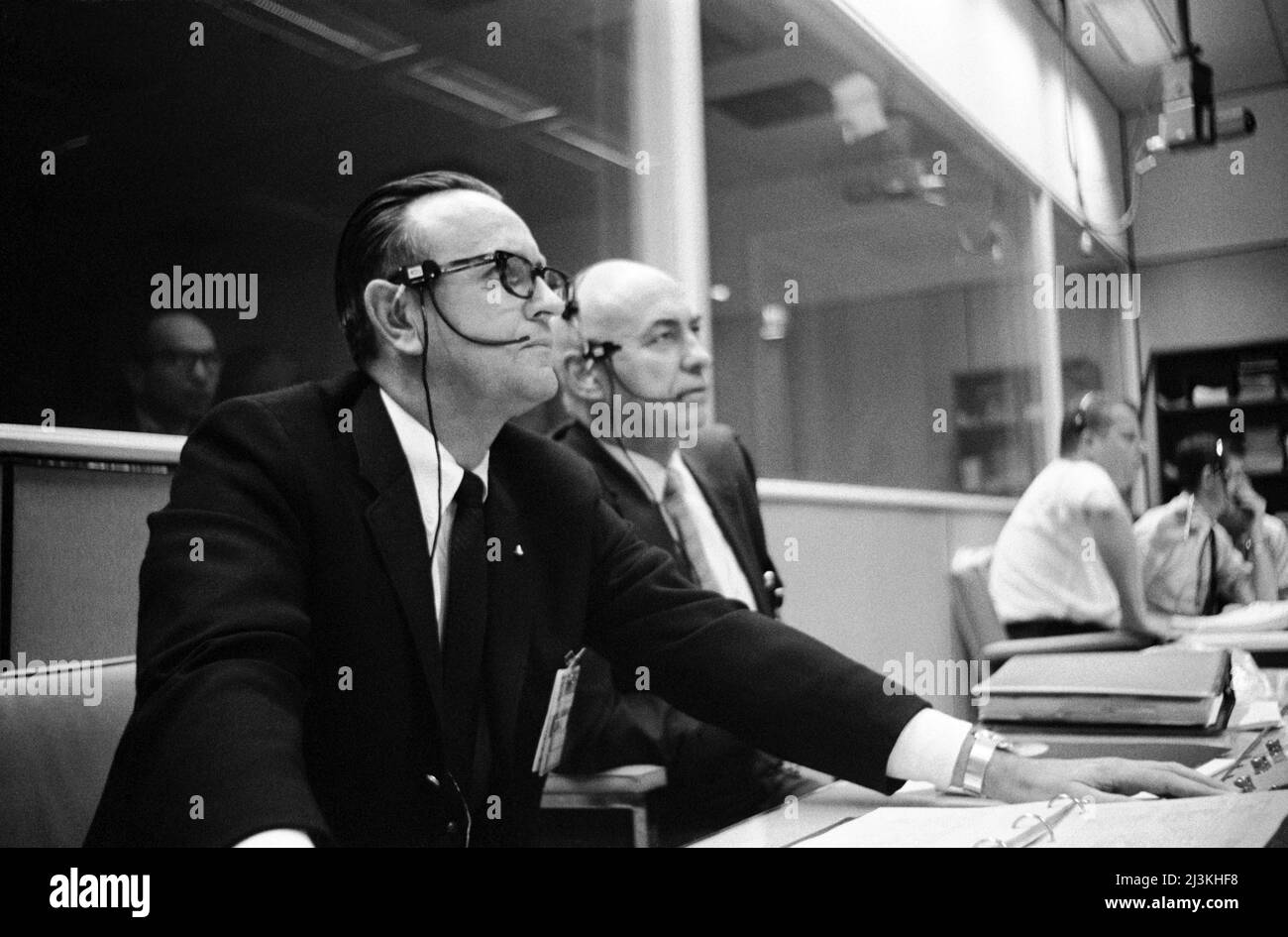 Director of Flight Operations Christopher C. Kraft (left) and Manned Spaceflight Center director Robert R. Gilruth in Mission Control during Apollo 5 Stock Photo