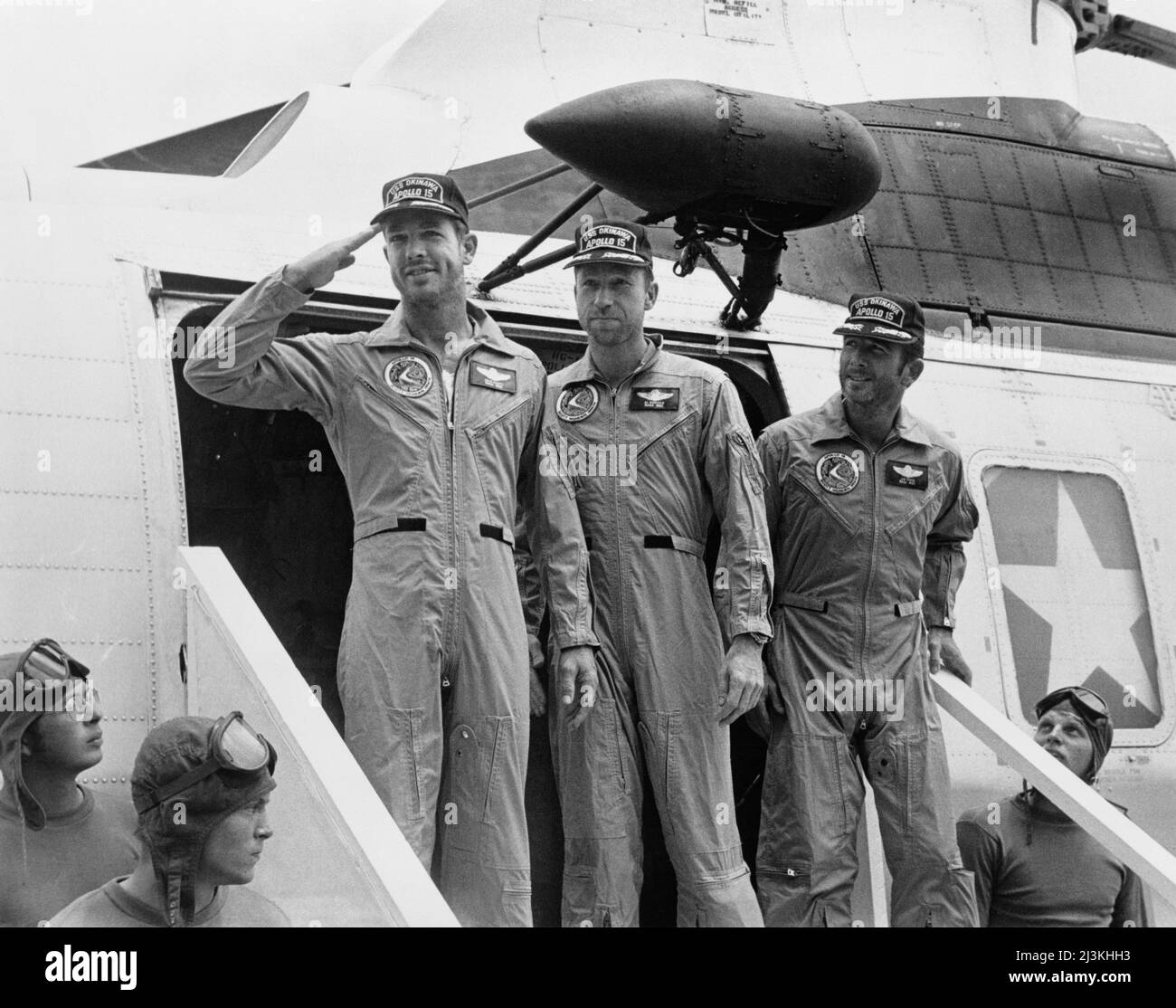 The apollo 15 astronauts disembark their helicopter aboard the USS Okinawa after their splashdown and recovery. They are, from left to right, David Scott, Alfred Worden and James Irwin Stock Photo