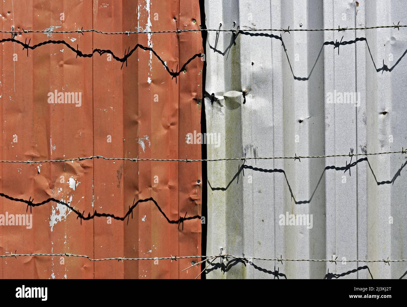 Metallic surfaces and barbed wire Stock Photo