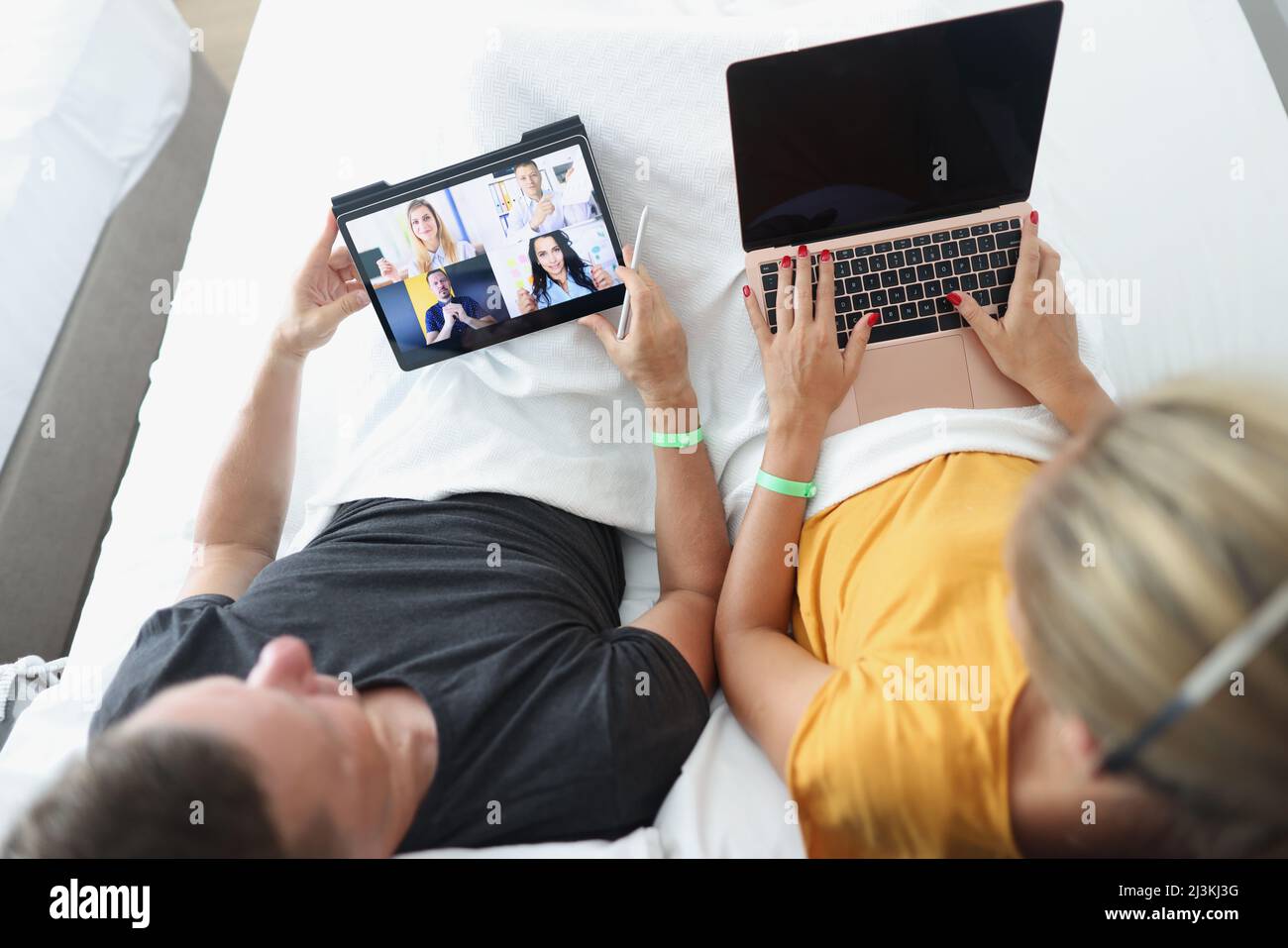 Man and woman remotely communicate with business partners Stock Photo