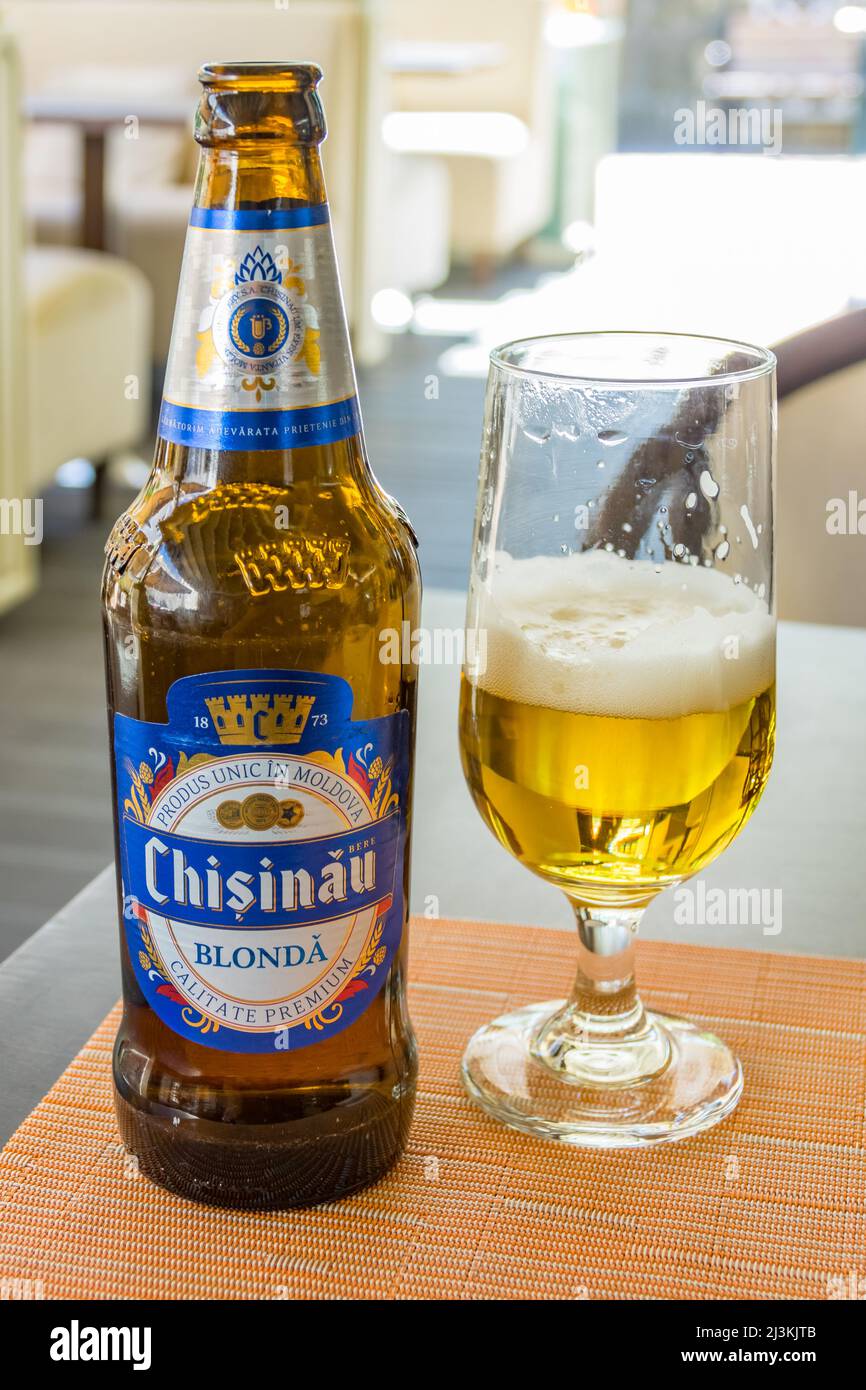 A bottle and glass of Chisinau beer in Chisinau Moldova Stock Photo