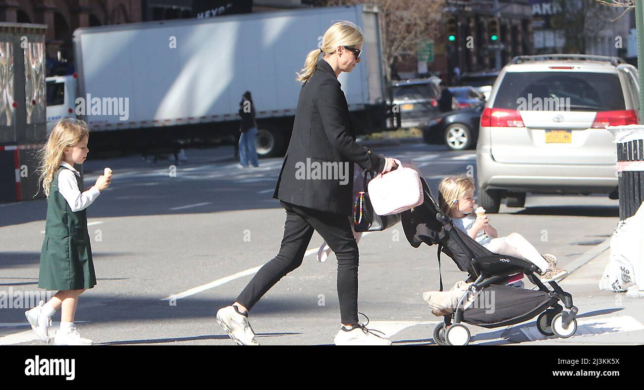 Walking in soho with her daughters new york city hires stock