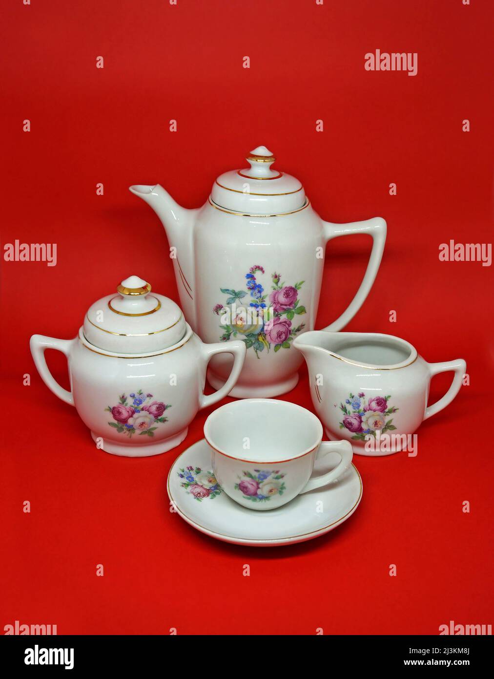 Vintage porcelain coffee set coffe pot, milk pot, sugar bowl and cup Stock Photo Alamy