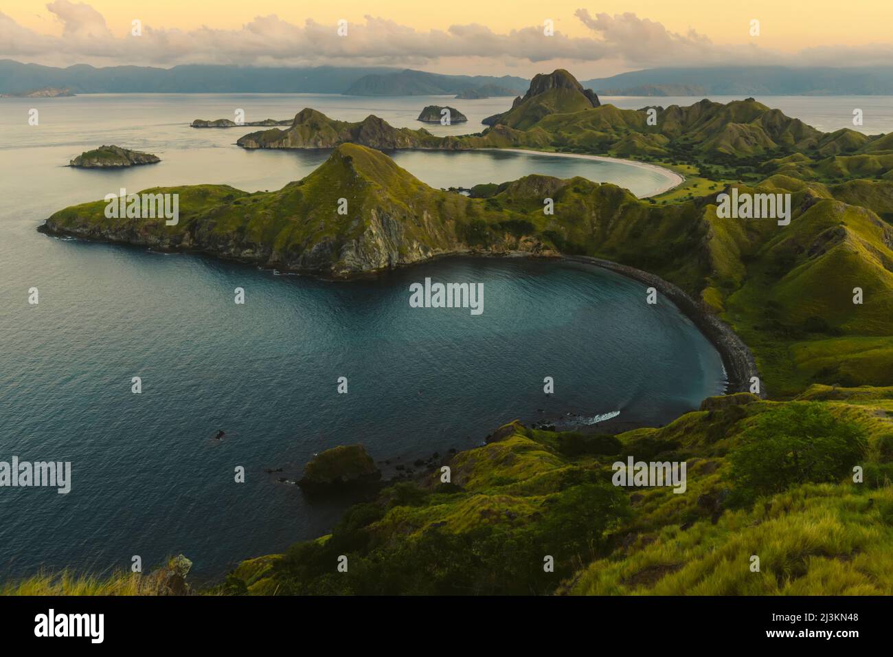 View of the bay with a black sand beach and a white sand beach in the background at Padar Island in Komodo National Park in the Komodo Archipelago ... Stock Photo