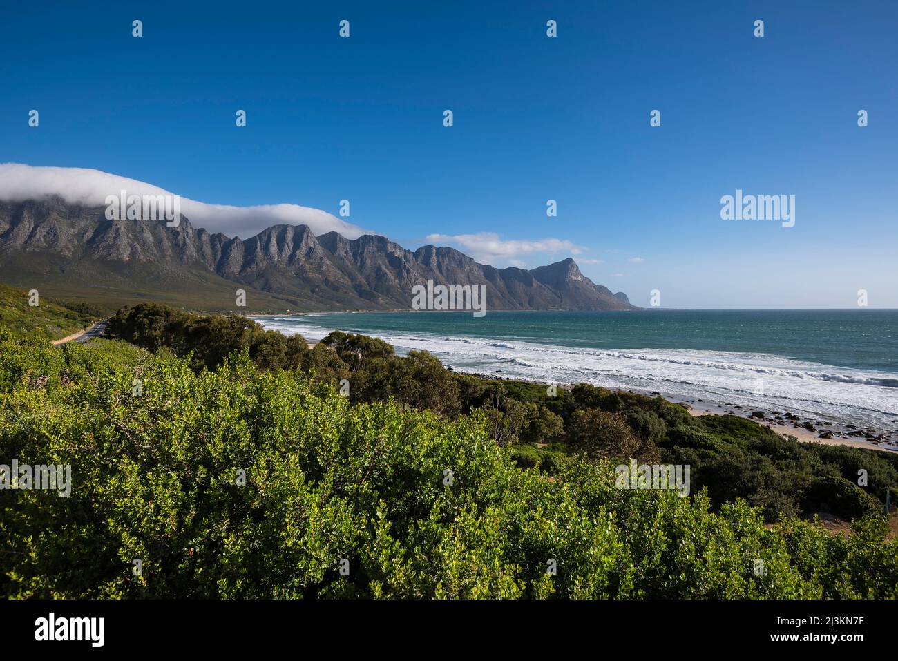 View overlooking Kogel Bay Beach along the scenic R44 Route with the Kogelberg Mountains in the distance Stock Photo