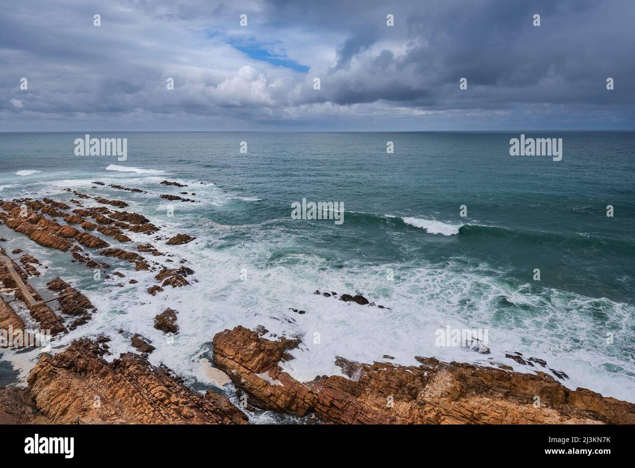 View from the Cape St Blaize Lighthouse of the rocky shore and Atlantic Ocean at Mossel Bay along the Garden Route Stock Photo
