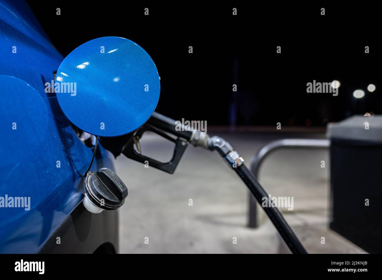 Vehicle with gas pump inserted to fill the empty tank Stock Photo Alamy