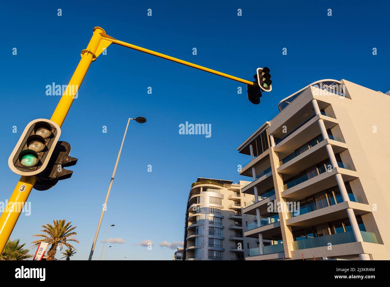 Traffic lights and residential buildings on a sunny day; Cape Town