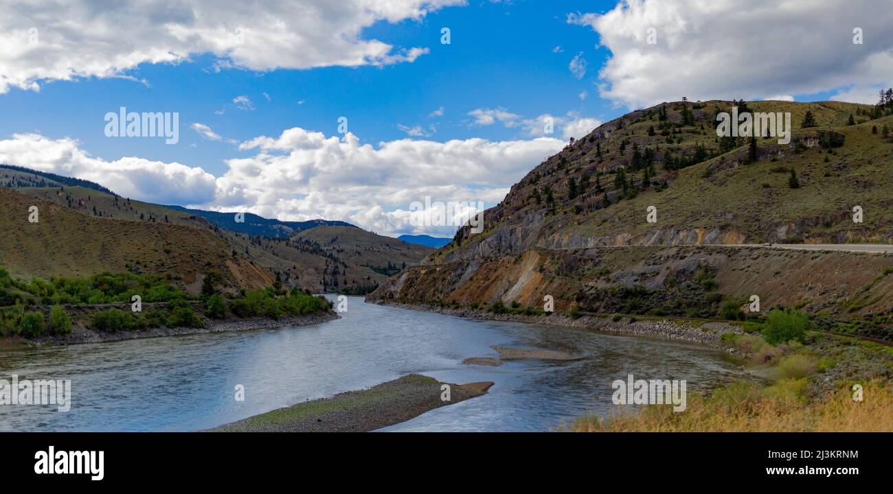 River flowing through a mountainous landscape in Interior BC, on a drive North from Surrey to Likely, BC, Canada; British Columbia, Canada Stock Photo