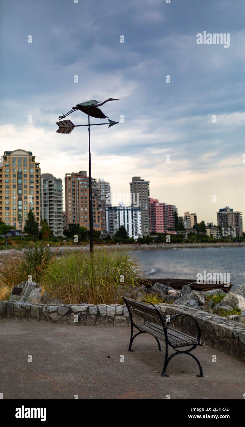 Viewpoint with bench and weather vane, and colourful residential high