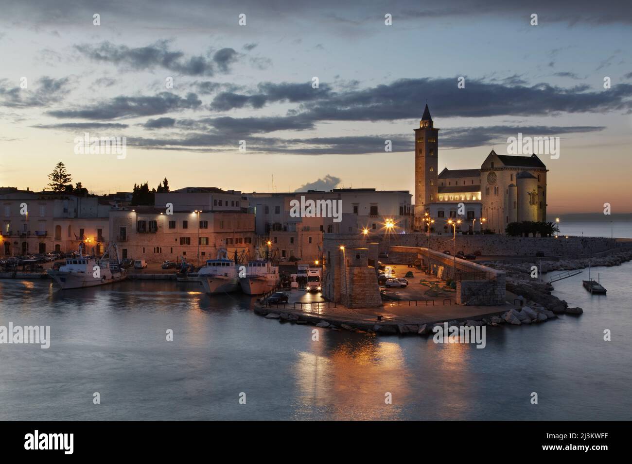 A dusk view of the fishing harbor of Trani.; Trani, Puglia, Italy. Stock Photo