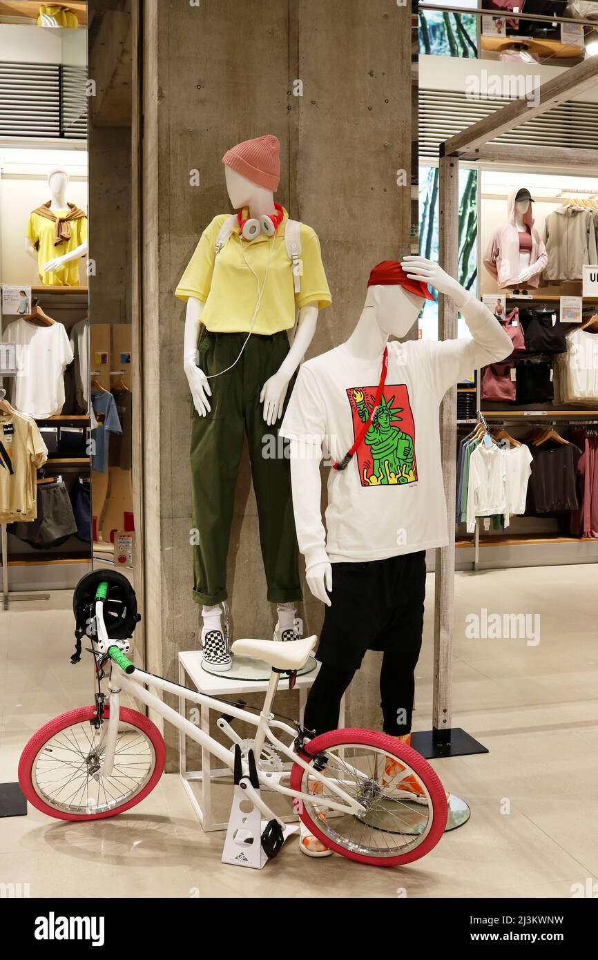 TOKYO, JAPAN - March 29, 2022: Display featuring mannequins and a BMX  bicycle in Uniqlo Tokyo store in Ginza Stock Photo - Alamy
