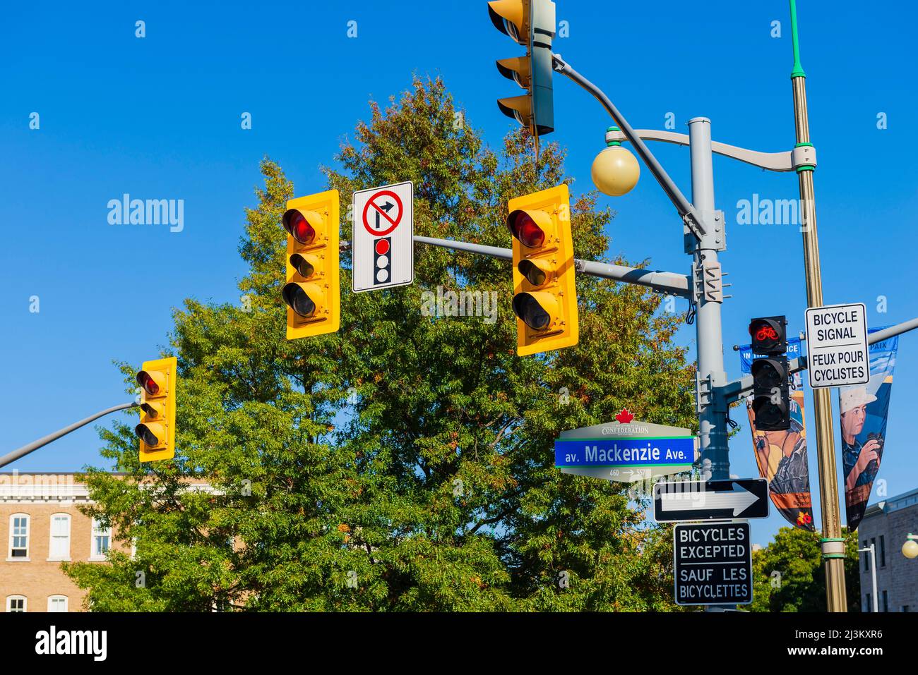 Traffic signs and traffic lights at an intersection; Ottawa, Ontario