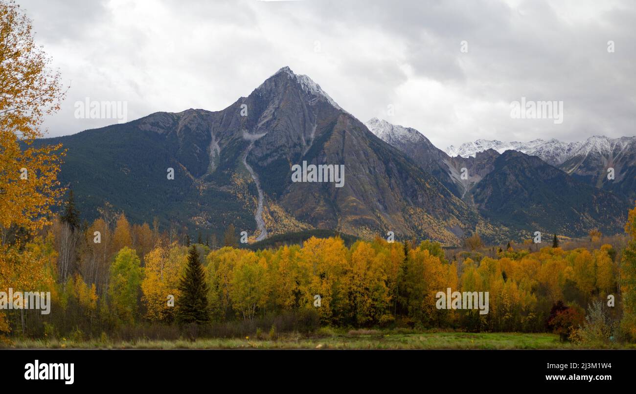 Autumn foliage and rugged mountains along Highway 16 driving West through Smithers, BC and beyond; British Columbia, Canada Stock Photo