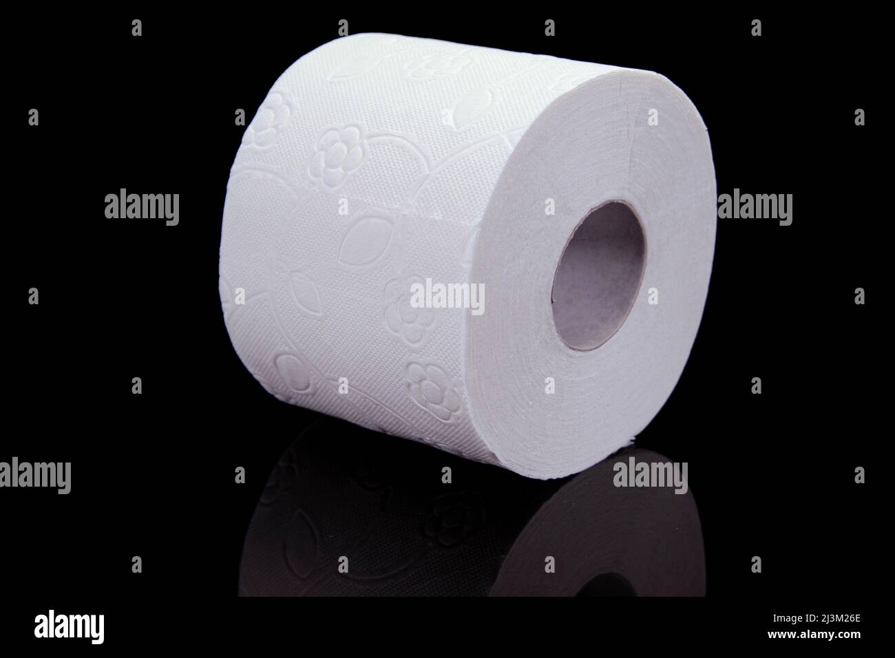 Toilet paper roll on a black background. Presentation of toilet paper roll,  isolated on black background Stock Photo - Alamy