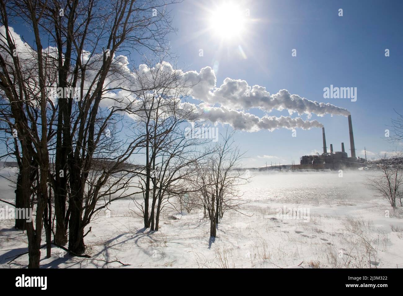 Coal fired power plant in winter with emissions blowing downwind; Mount