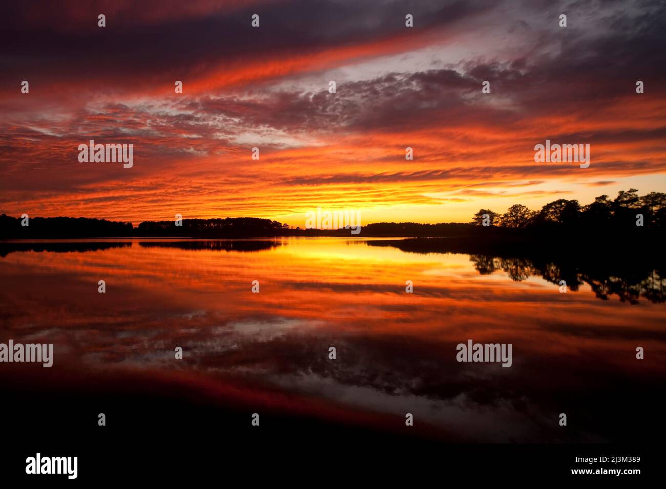 Sunset over a Chesapeake Bay shoreline.; Kent Island, Maryland. Stock Photo