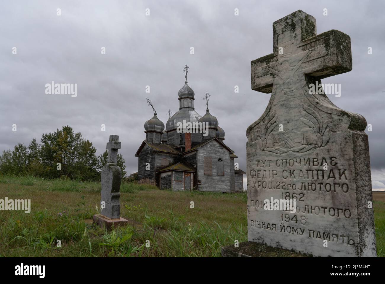 Abandoned Ukrainian Orthodox church and cemetery in rural Saskatchewan; Maryville, Saskatchewan, Canada Stock Photo