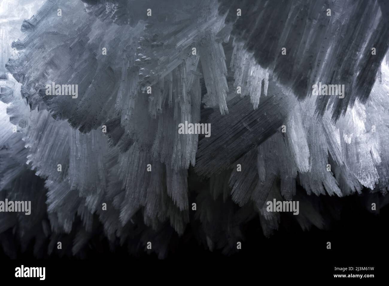 Detail photograph of the giant ice crystals clinging to the walls and ceiling of The Crystal Palace cave.; Greenland. Stock Photo