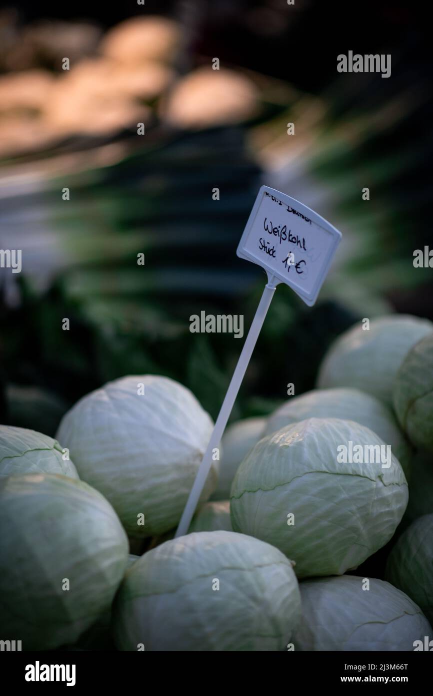 Oberhausen, Germany. 09th Apr, 2022. White cabbage lies on a sales floor at the weekly market in Oberhausen-Sterkrade. Due to the war in Ukraine, the prices of many products are rising, even basic foodstuffs are affected. Credit: Fabian Strauch/dpa/Alamy Live News Stock Photo