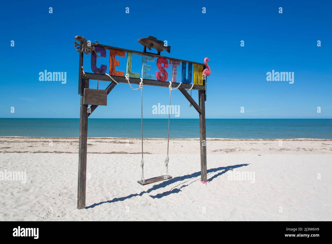 Swing with Celestun sign on a white sand beach on the coast of the Gulf of Mexico; Celestun, Yucatan State, Mexico Stock Photo