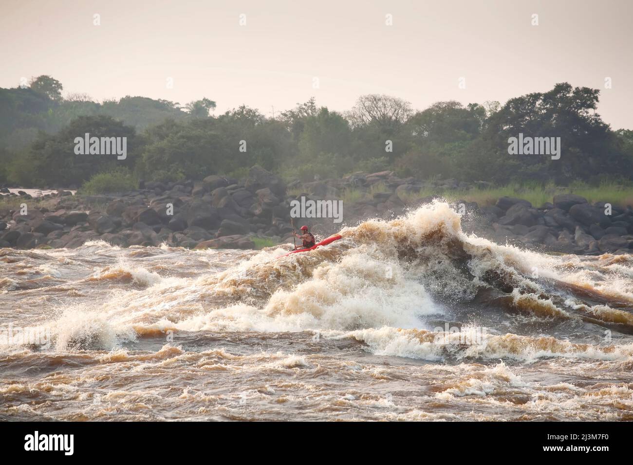 A kayaker paddles through the Kinsuka Rapids on the lower Congo River