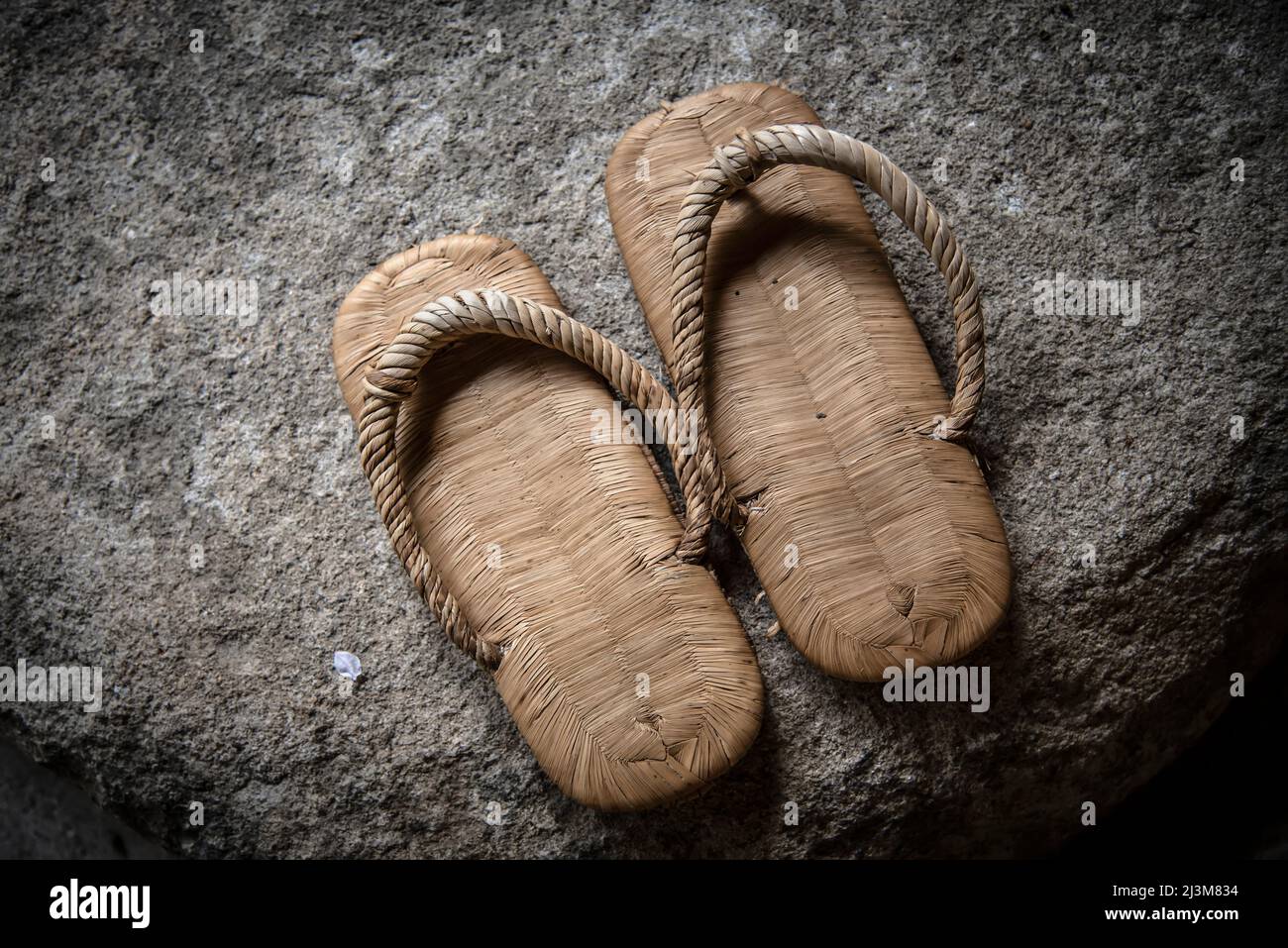 Traditional Japanese sandals on a rock; Miyajima, Japan Stock Photo
