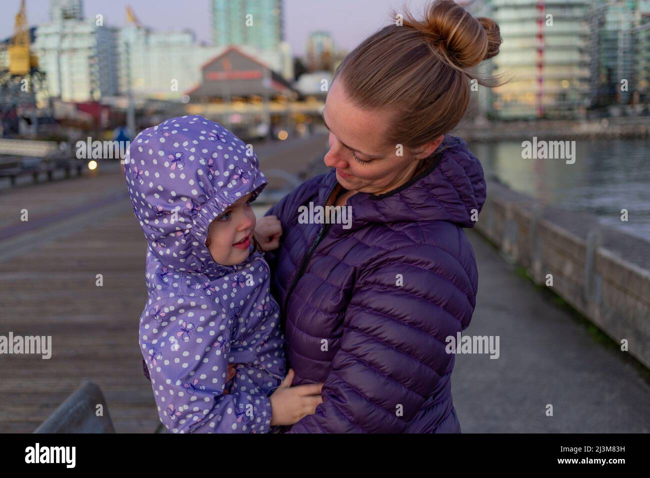 Mother and young daughter at Lonsdale Quay; North Vancouver, British Columbia, Canada Stock Photo