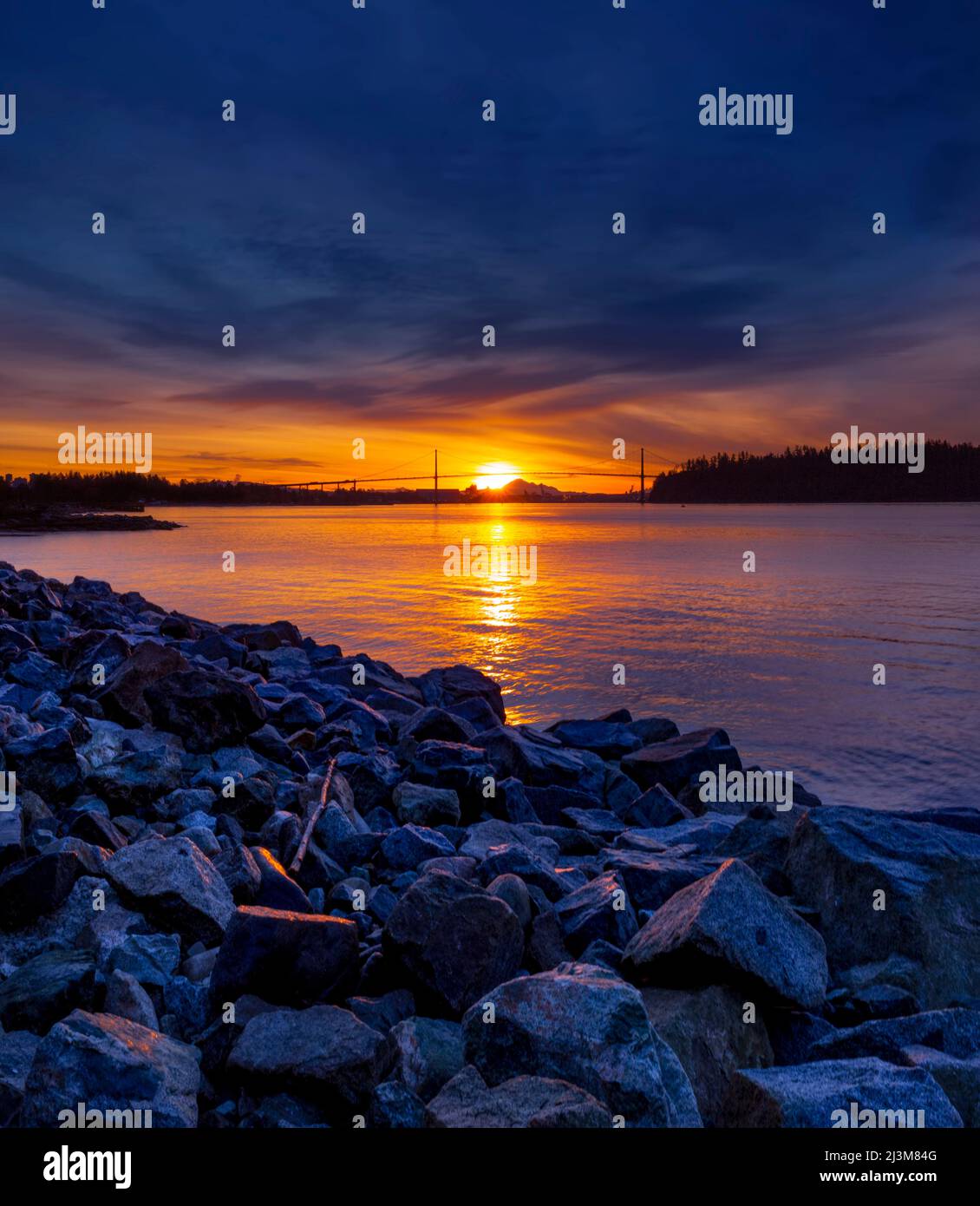 Brilliant colours of a sunrise viewed from the seawall in West