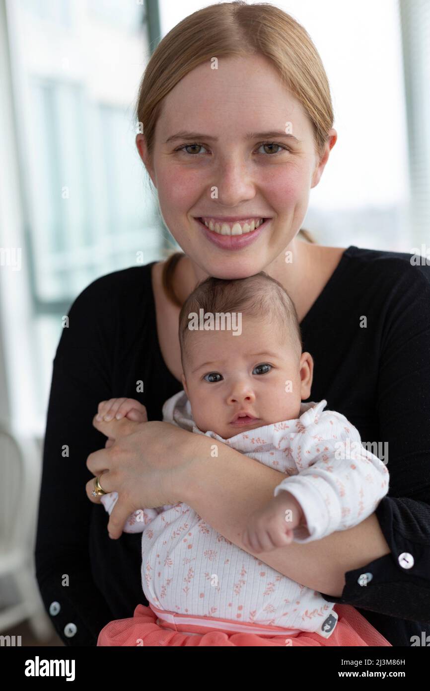 Portrait of a new mother with her baby daughter; Surrey, British Columbia, Canada Stock Photo