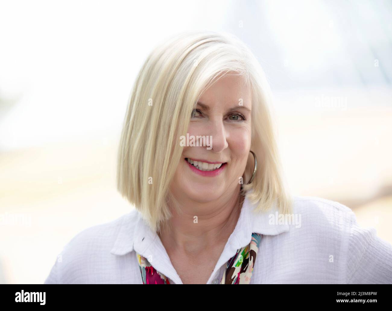 Close-up portrait of a mature woman with white hair; Edmonton, Alberta, Canada Stock Photo